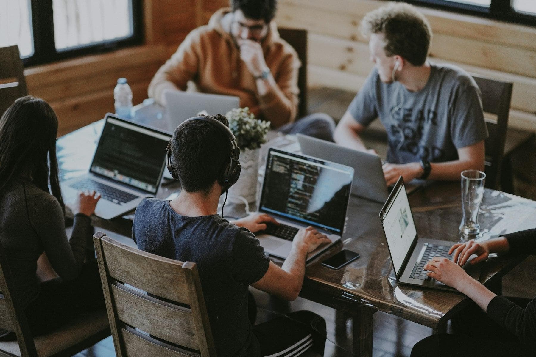 Product team collaborating on laptops